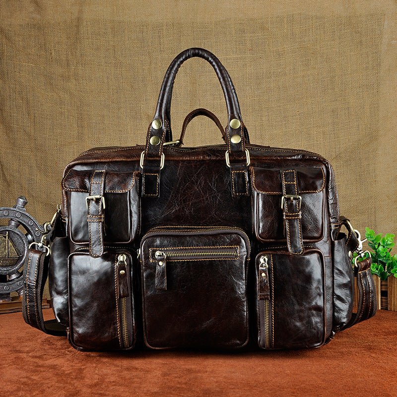 First layer cowhide men's 16-inch large-capacity briefcase with multiple compartments and sturdy handle, crafted by Plush Fashion Hub.