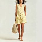 Women's sleeveless vest top and shorts set by FitiqueFit, casual two-piece outfit shown in light fabric and relaxed fit.