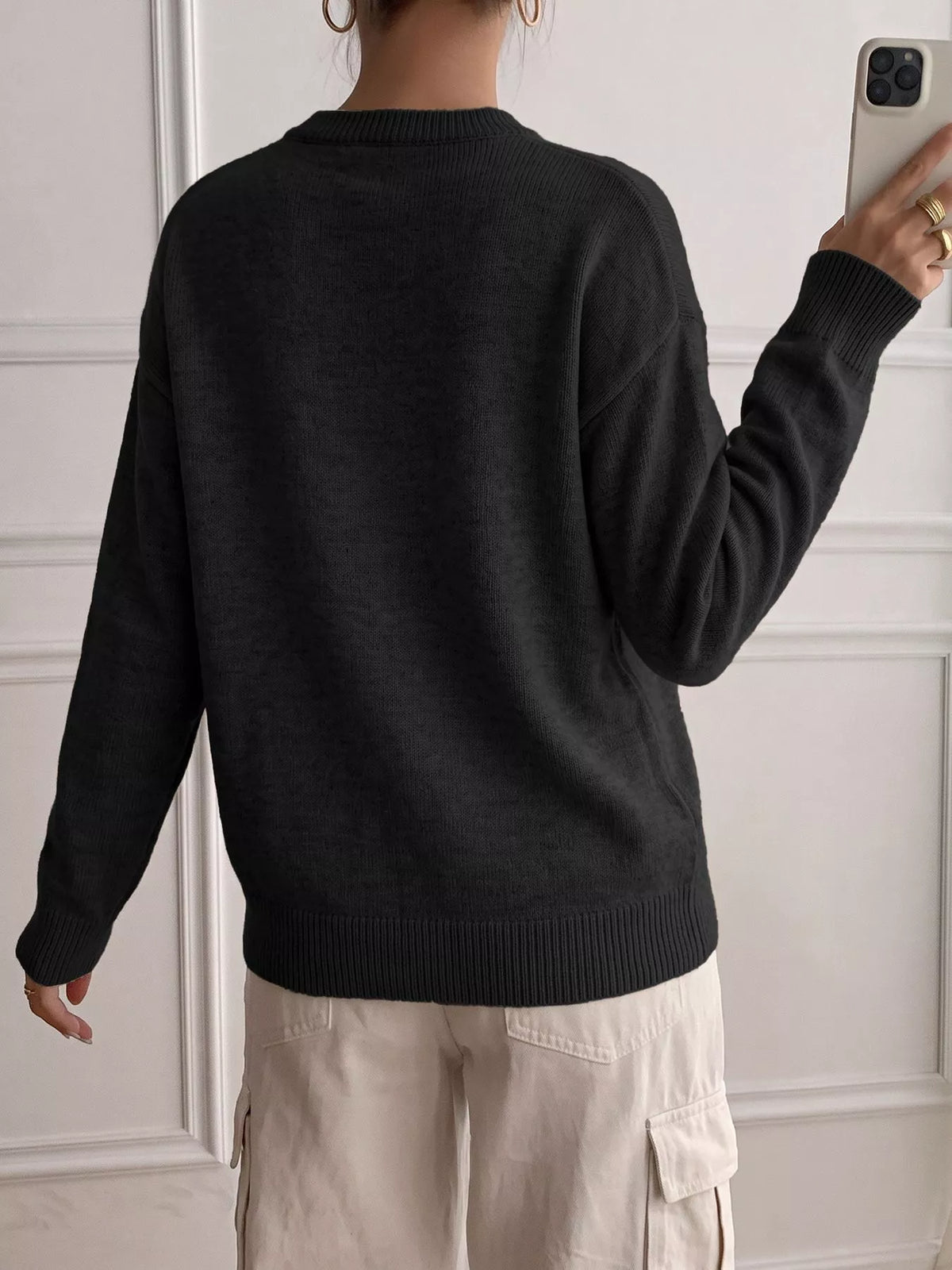 Ribbed knit sweater with decor button placket from Trendsi, featuring a cozy, fitted design in neutral tones.
