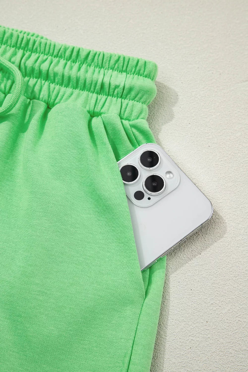 Solid color puffy loose top and drawstring shorts from Trendsi, displayed as a 2-piece outfit with rings on a neutral background.