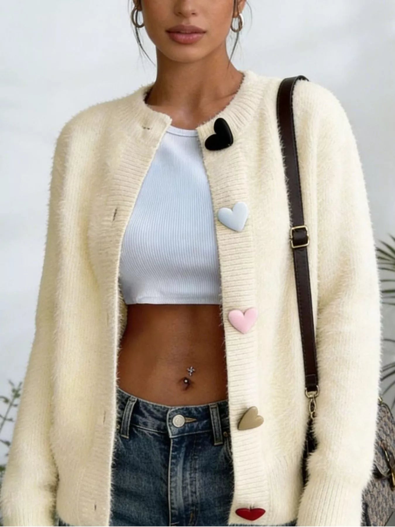 Plus size long sleeve heart button cardigan in knitwear style, featuring a full size fit and trendy design from Trendsi.