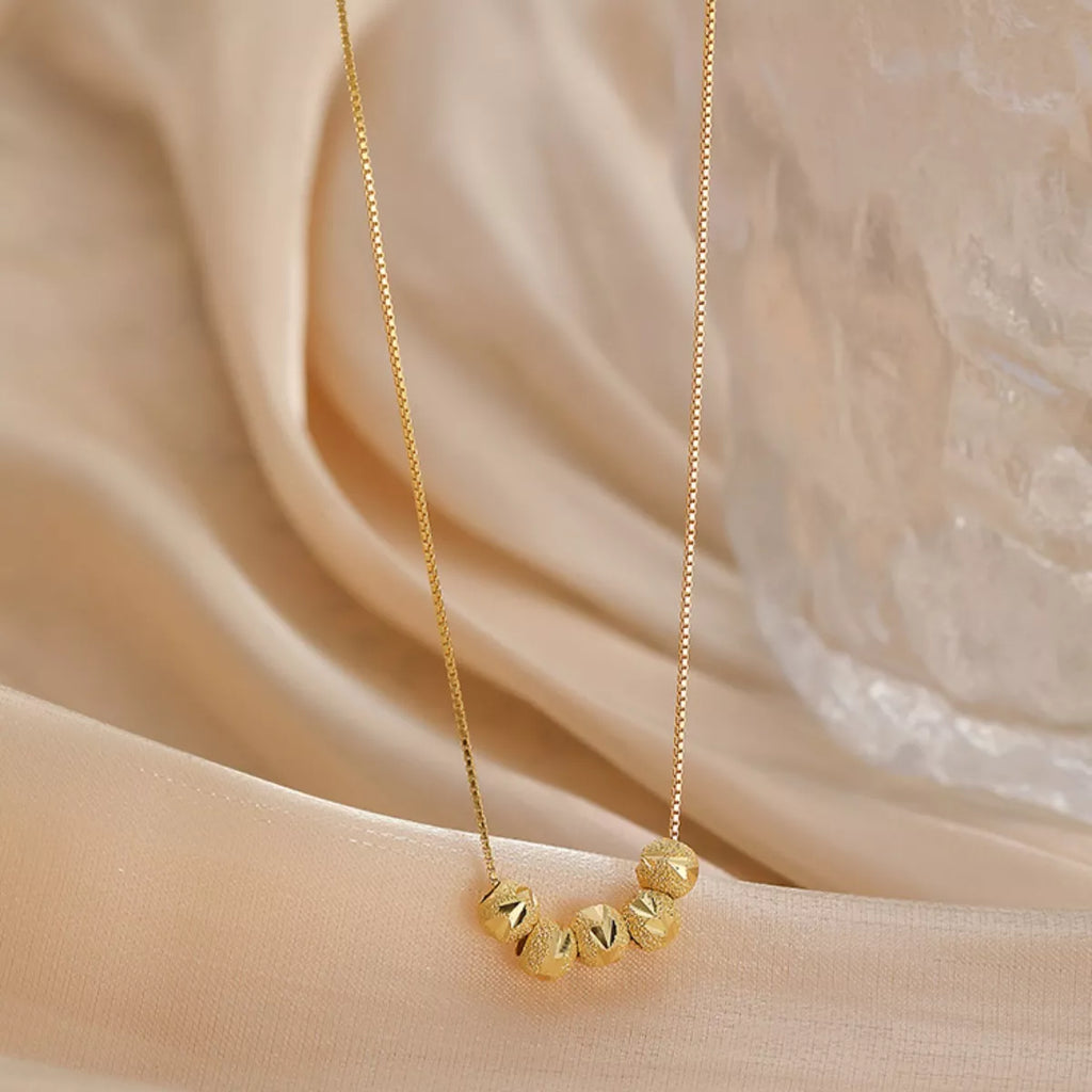 Sterling silver beaded necklace with small round beads, crafted by Shopimist, displayed against a neutral background.