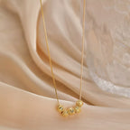 Sterling silver beaded necklace with small round beads, crafted by Shopimist, displayed against a neutral background.