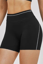 Fitglutes Activewear sports bra and shorts 2-piece set, black workout gymwear, stretchy fabric, designed for active fitness and sports activities.