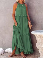 Ruffled tiered sleeveless maxi dress by Plush Fashion Hub, featuring flowing fabric and layered design for elegant summer style.