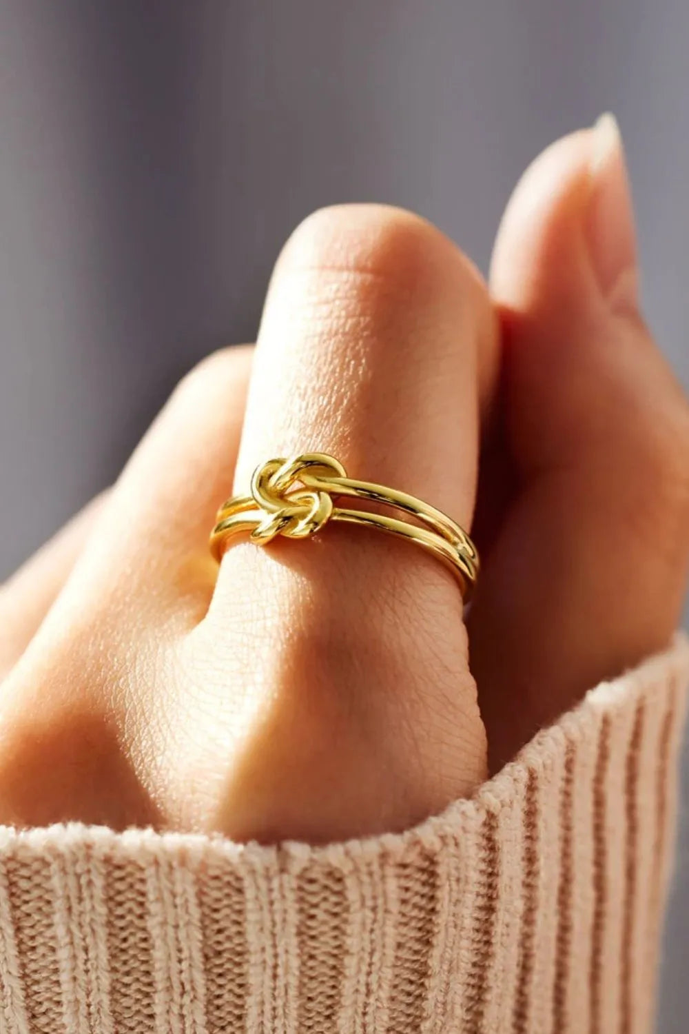 Sterling silver knotted ring from Plush Fashion Hub featuring a sleek, polished design with intricate knot details.