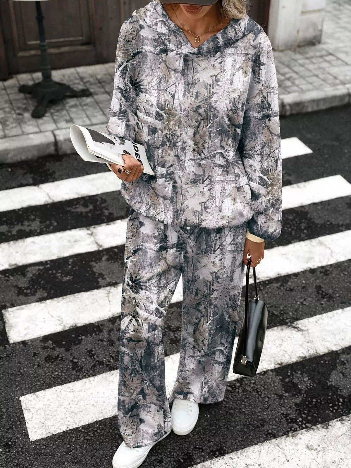 Printed long sleeve hoodie and pants set by Trendsi, featuring a comfortable matching casual outfit with stylish design.
