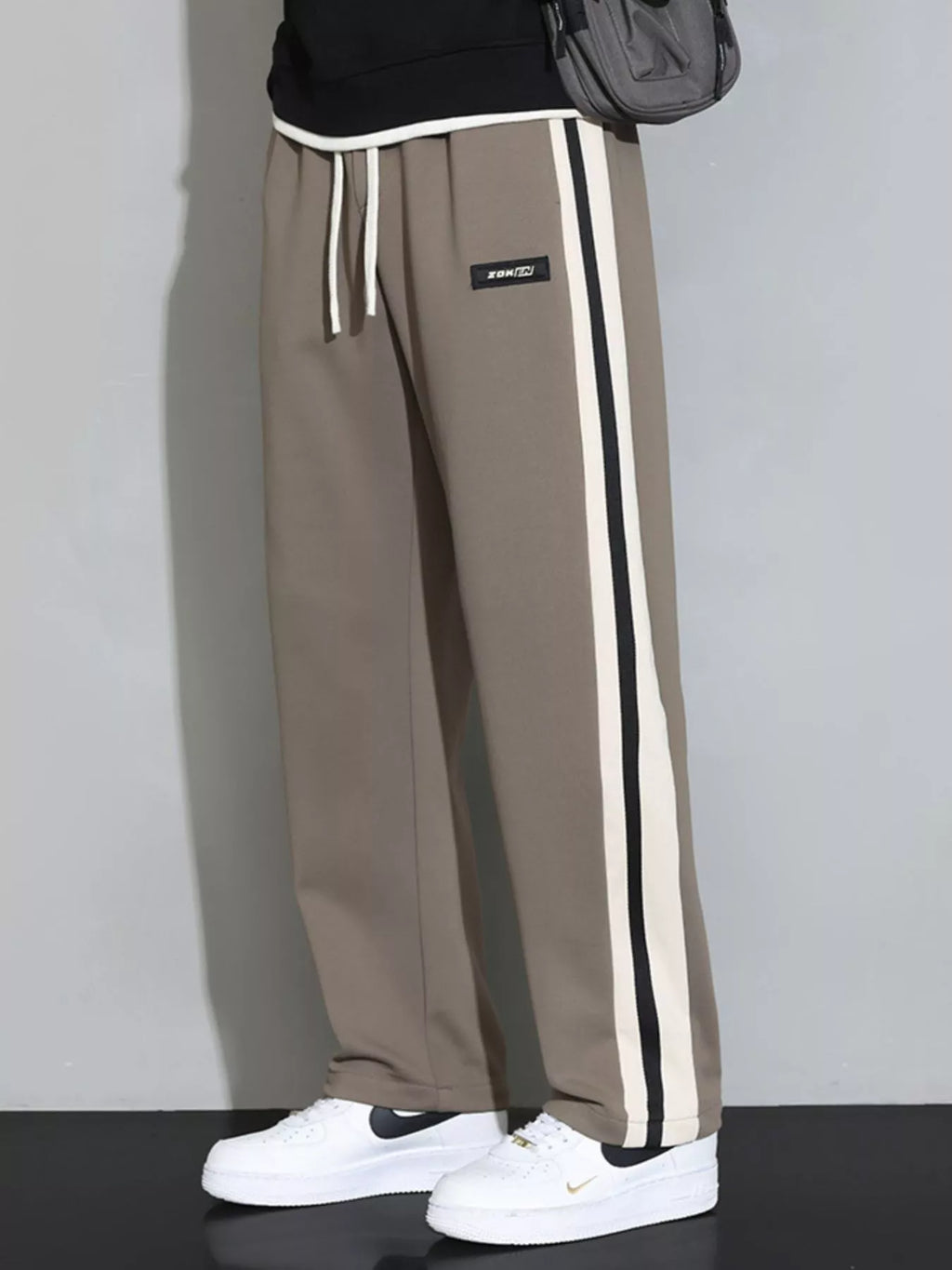 Men's plus size casual loose pants with side stripes, Shopimist brand, featuring a relaxed fit and comfortable fabric.