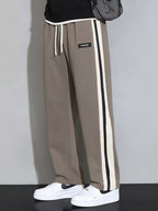 Men's plus size casual loose pants with side stripes, Shopimist brand, featuring a relaxed fit and comfortable fabric.