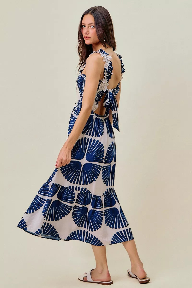 Abstract print smocked bodice tiered lined midi dress by Plush Fashion Hub, featuring a flowing tiered design and vibrant patterns.