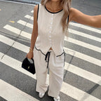 Women's contrast color sleeveless vest and drawstring trousers suit by FitiqueFit, shown in six different colors, available in sizes S to XXL.