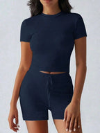 Trendsi activewear set with round neck short sleeve top and matching shorts, lightweight and comfortable for workouts or casual wear.