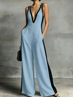 Deep V-neck wide-leg jumpsuit with contrast trim, stylish women's jumpsuit from Shopimist, featuring a flattering fit and modern design.