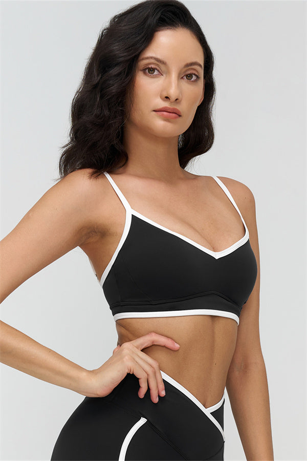 Fitglutes Activewear contrast sports bra and leggings 2-piece set, featuring stylish black and white color blocks for workout comfort.