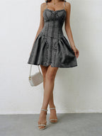 VYSN ruched zip-up spaghetti strap denim dress displayed on a hanger with front detailing and adjustable straps.