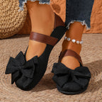 Women's chic bow round toe slip-on flats made of vegan leather, stylish and comfortable shoes by Trendsi.