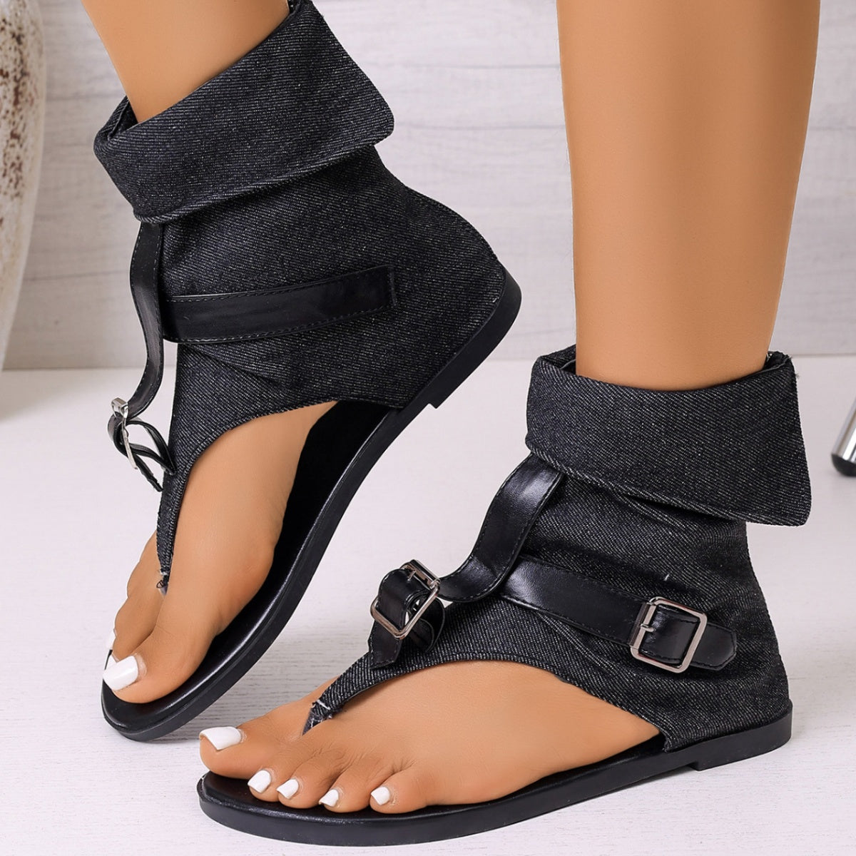Shopimist toe post buckle sandals with leather straps and metal buckles, shown on a model's foot.