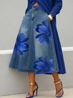 Women's floral print A-line midi skirt by FitiqueFit featuring denim-style fabric and boho-inspired design.