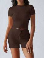 Trendsi active wear set with a round neck short sleeve top and matching shorts, made from comfortable fabric, displayed on a mannequin.