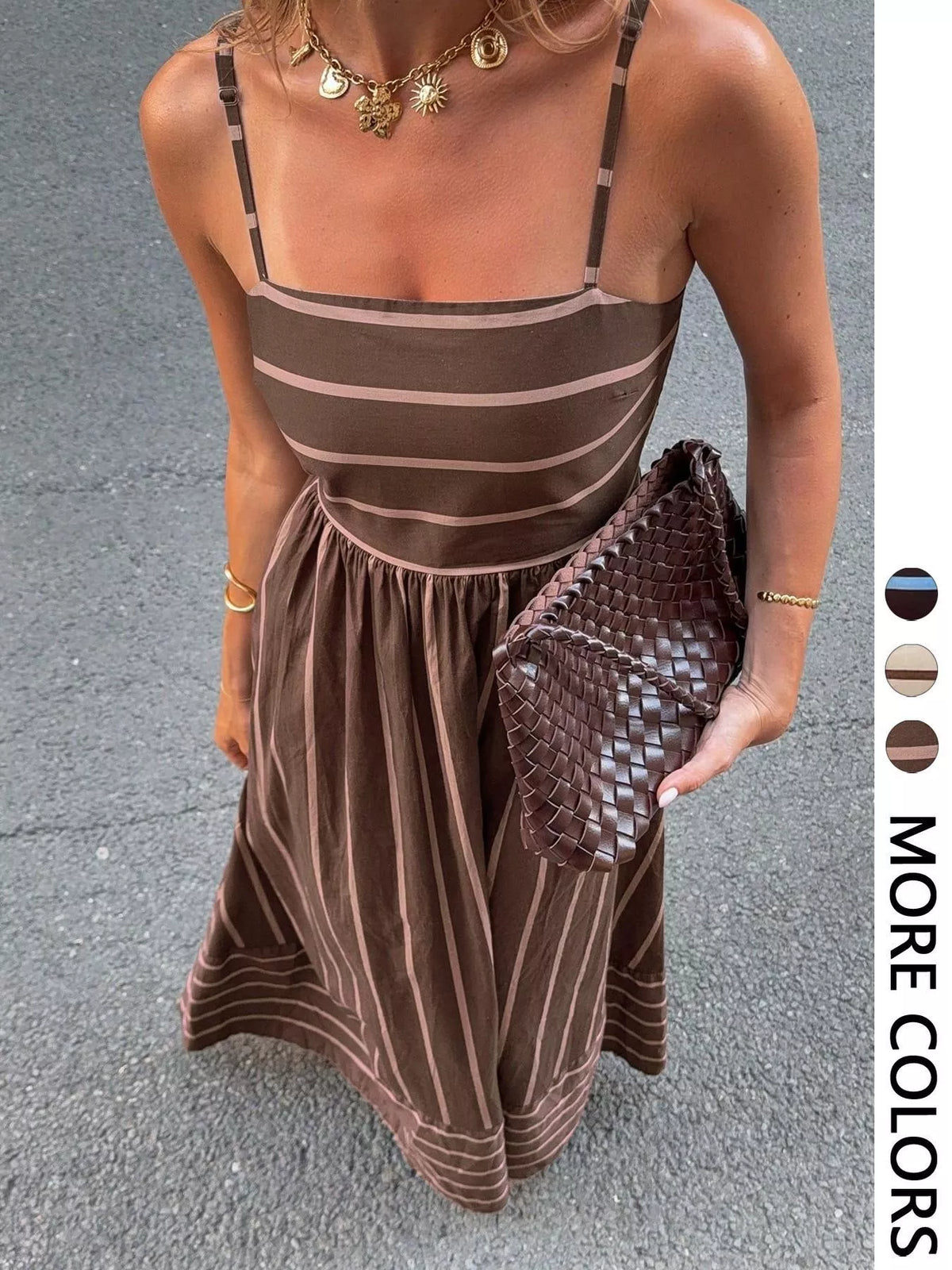 Striped cutout back maxi dress by Plush Fashion Hub featuring a flowing design and bold vertical stripes.