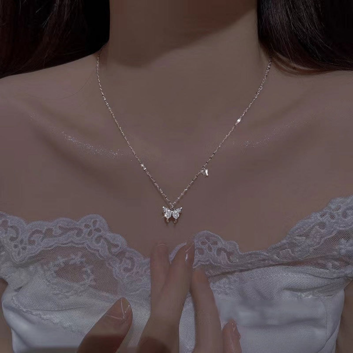 Sterling silver zircon butterfly necklace with delicate chain, featuring a sparkling butterfly pendant, designed by Shopimist.