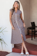 Threaded Pear Sarahi Flare Sleeveless Maxi Dress displayed on a hanger with flowing fabric and vibrant pattern.