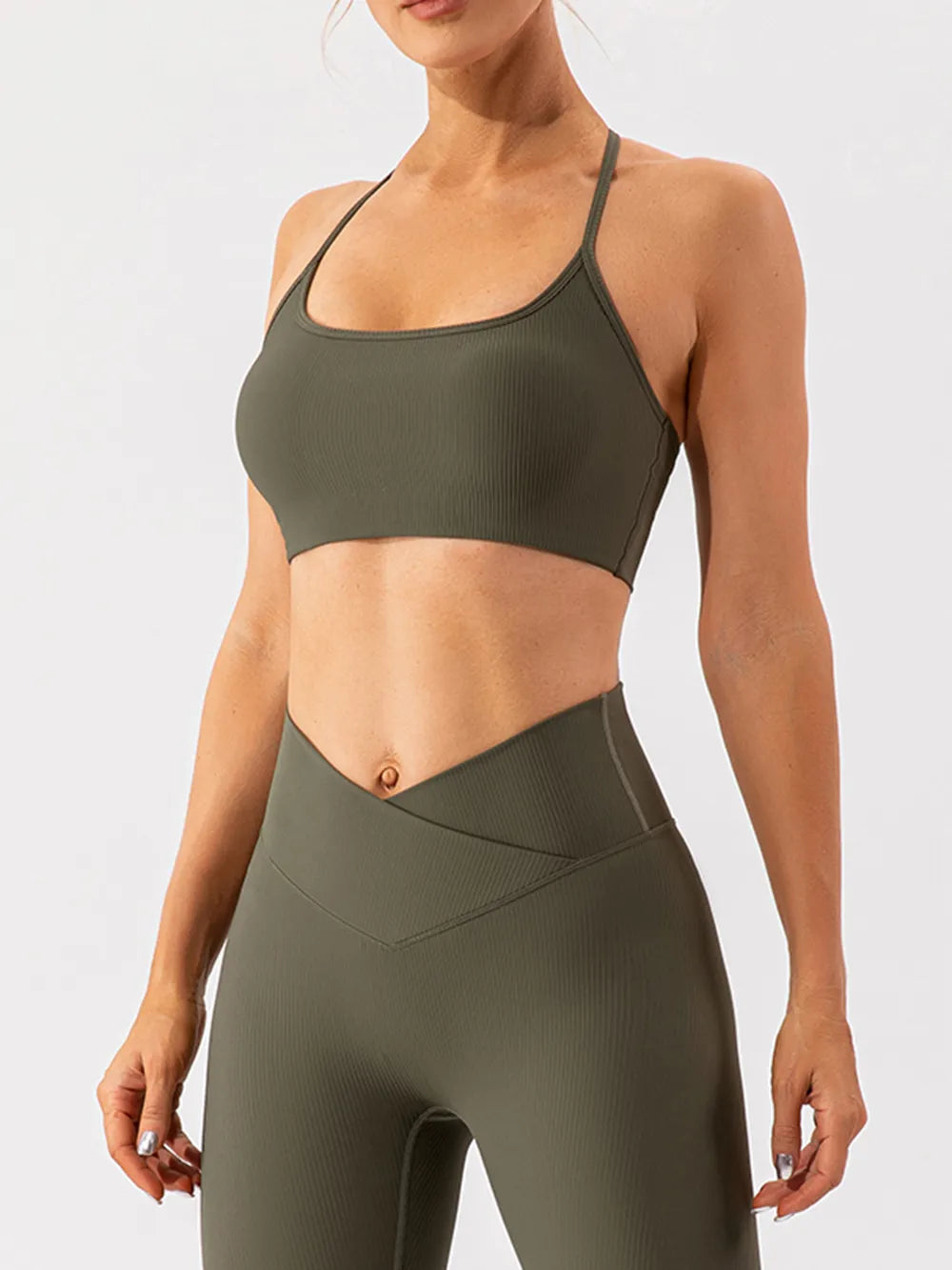 Trendsi spaghetti strap active bra in black, featuring a sleek design and lightweight fabric, ideal for workout and active wear.