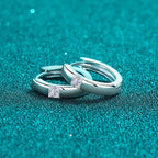 Sterling silver Moissanite huggie earrings with sparkling gemstones, stylish and elegant jewelry by Shopimist.