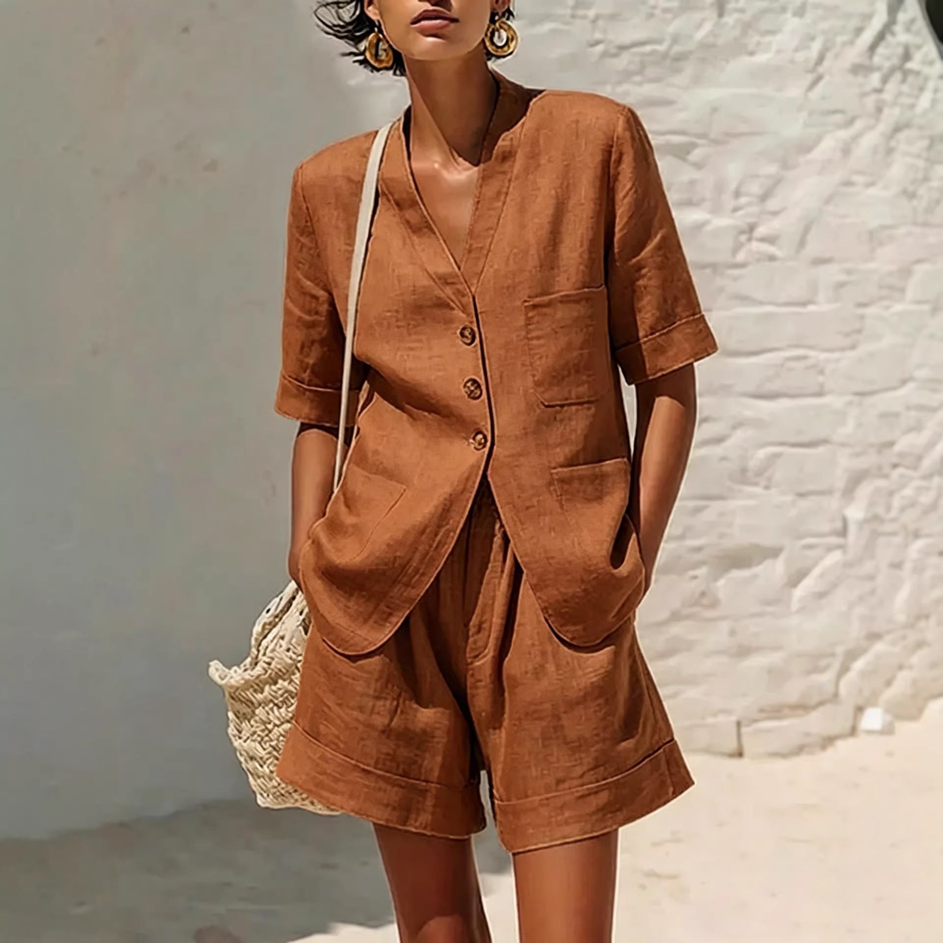Women's cotton-linen loose-fit T-shirt and cropped shorts two-piece casualwear set by FitiqueFit, shown on a model outdoors.
