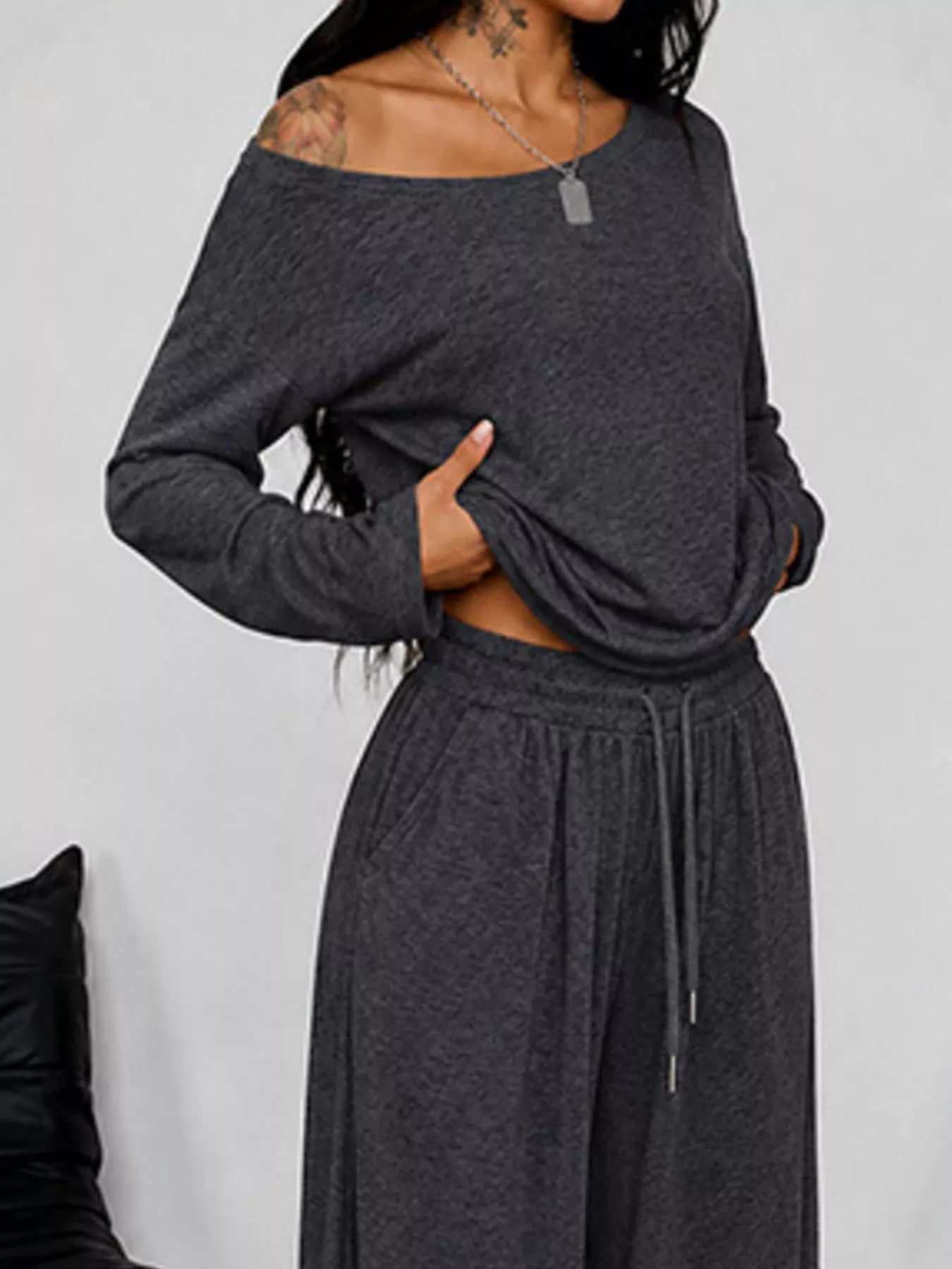 Plus size one-shoulder top and drawstring pants set by Trendsi, stylish full-size women's clothing, front view.