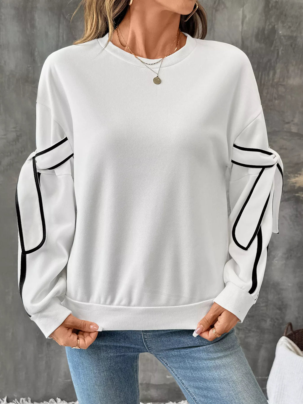 Trendsi side striped round neck sweatshirt showing a casual top with contrasting stripe details on the sleeves and neckline.