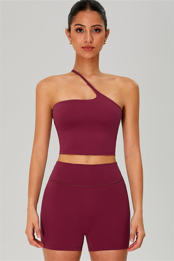 Fitglutes activewear one-shoulder crop top and matching shorts set, stylish gymwear and workout clothes for women.