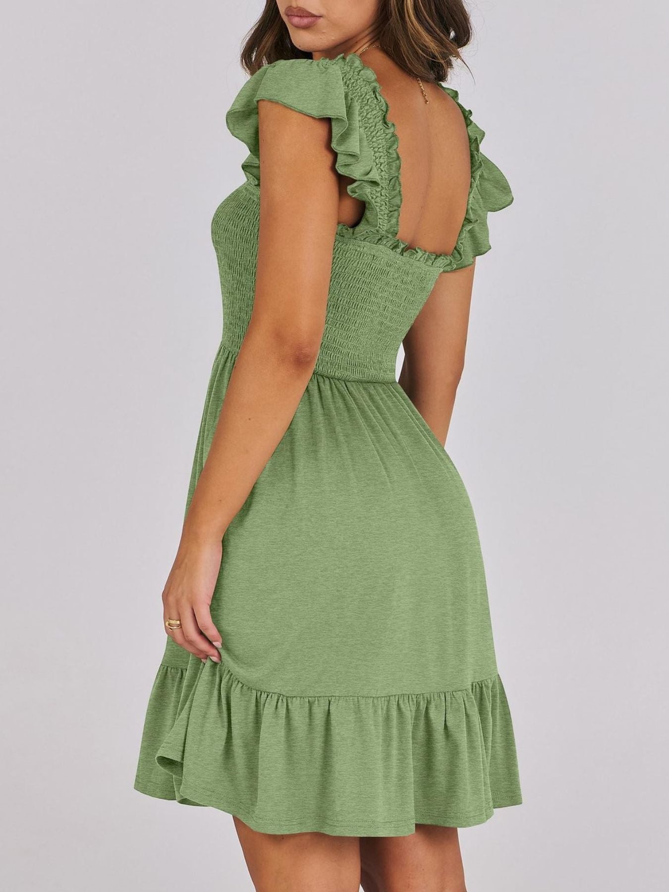 Women's lightweight smocked ruffle hem mini dress by Trendsi, casual summer dress with a breezy, relaxed fit and ruffle details.