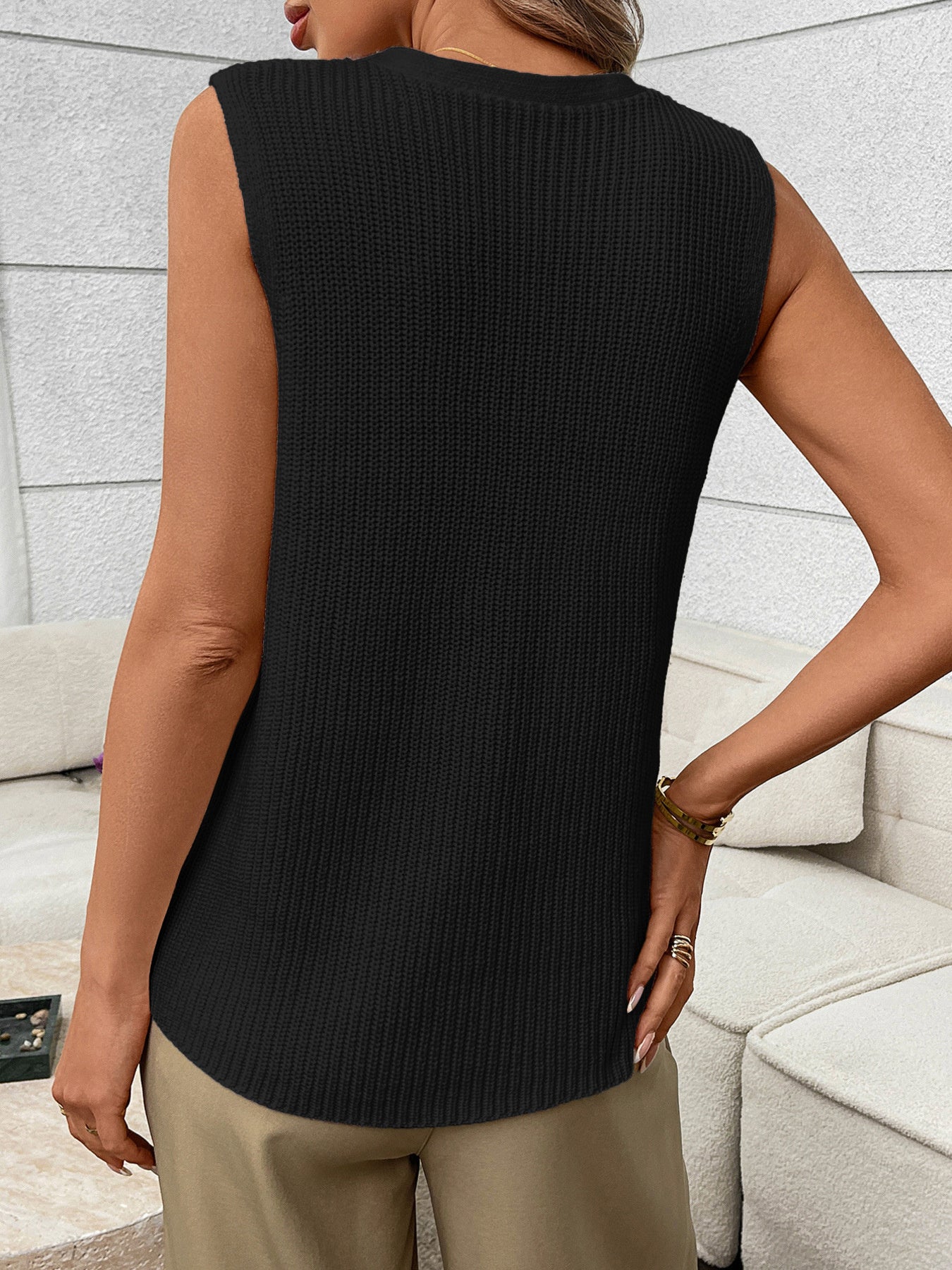 Women's sleeveless knit sweater vest with side pockets, featuring button-down front, by Trendsi, perfect for casual layered looks.