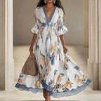 Women's floral print maxi dress with deep V-neck and flare sleeves, casualwear by Plush Fashion Hub.