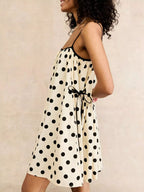 Polka dot spaghetti strap mini dress by Shopimist featuring a stylish, lightweight design with a playful pattern and feminine fit.