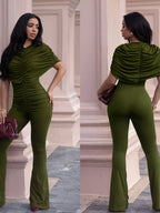 Ruched flare leg jumpsuit by Trendsi featuring a fitted bodice, ruched details, and wide flare legs in a stylish design.