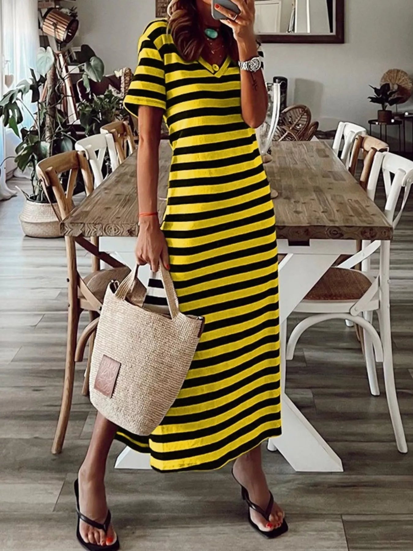 Plus size striped V-neck midi dress with side slit by Trendsi, featuring a full-length design and fashionable style.