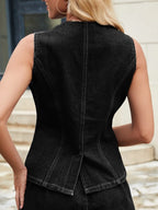 Denim vest top with button-front closure, sleeveless design, and trendy fit, perfect for casual styling.