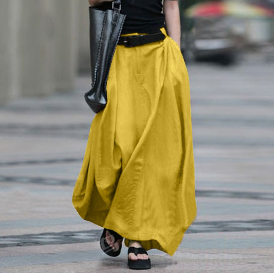 Women's high-waist flared maxi skirt in solid cotton linen with pockets by Plush Fashion Hub, shown in natural fabric detail.