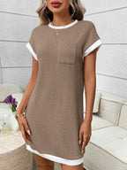 Ribbed knit mini dress with contrast trim and functional pocket, trendy dress by Trendsi, shown in a stylish view.