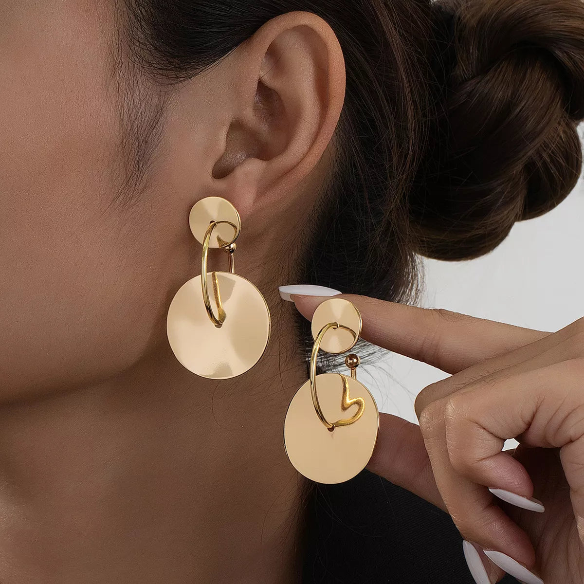 18K gold-plated geometric circle drop earrings with modern design, featuring sleek circular shapes and a stylish finish.
