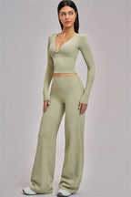 Fitglutes Activewear long sleeve crop top featuring a fitted design and stylish neckline, perfect for gym and workout sessions.