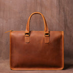 Men's Crazy Horse leather briefcase by Plush Fashion Hub with a sturdy handle and sleek design for carrying laptops.