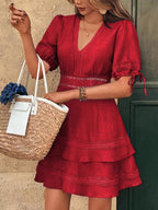 Lace detail V-neck mini dress from Shopimist featuring delicate lace accents and a stylish V-neck design.