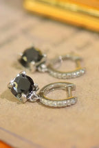Sterling silver drop earrings with 2 carat moissanite gemstones, featuring elegant design and sparkling brilliance.