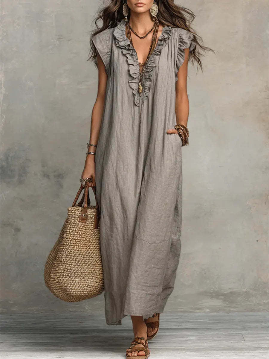 Women's spring and summer ruffle dress with pockets, elegant design by Plush Fashion Hub, shown in a light, flowy fabric.