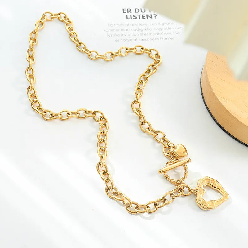 Titanium steel heart pendant necklace with polished finish, featuring a sleek and modern design, jewelry by Shopimist.