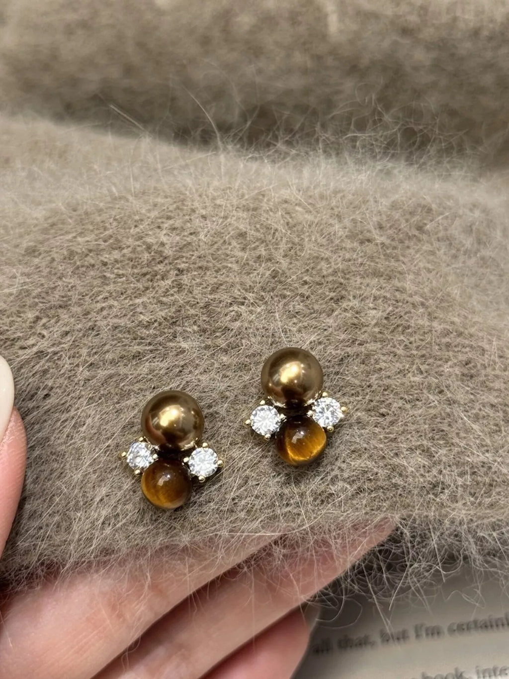Tiger Eye stud earrings featuring polished gemstone jewelry with gold-tone settings, perfect for stylish everyday wear.