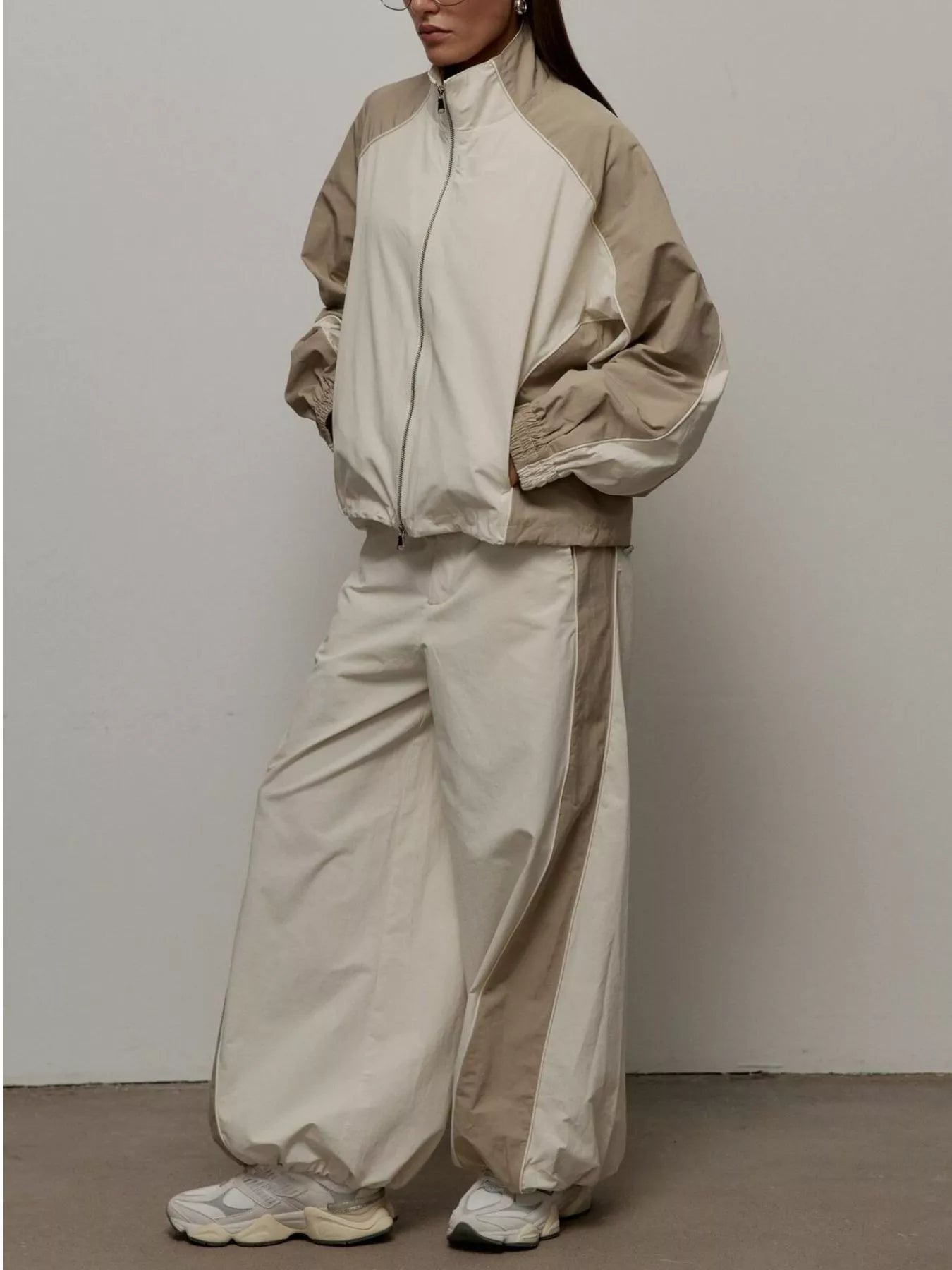 Color block zip-up outerwear and pants set by Plush Fashion Hub, featuring a stylish, coordinated casual outfit.